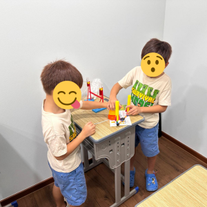 Students playing with toys at an Oxkids event