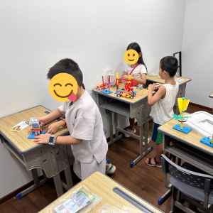 Students playing with toys at an Oxkids event